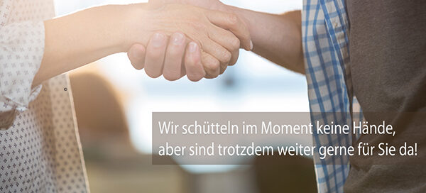 Zwei Hände schütteln sich.